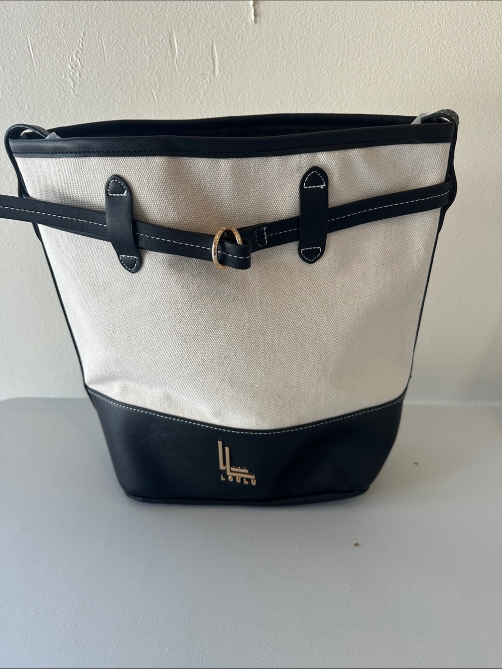 LouLu Canvas and Black Leather Bucket Bag with Gold Accent/adjustable strap.